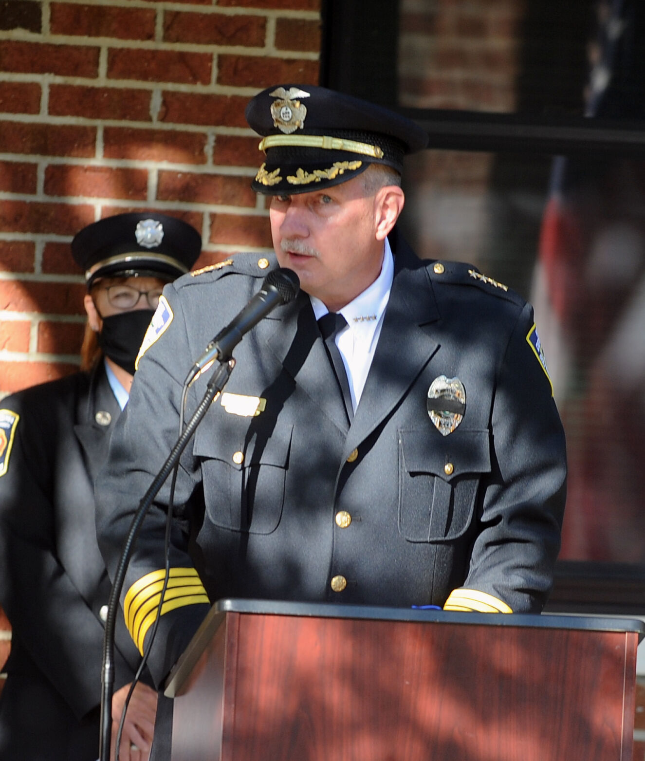 Police Chief Bob Temme speaks during a 9/11 ceremony at the Southern Pines Fire and Rescue Department.